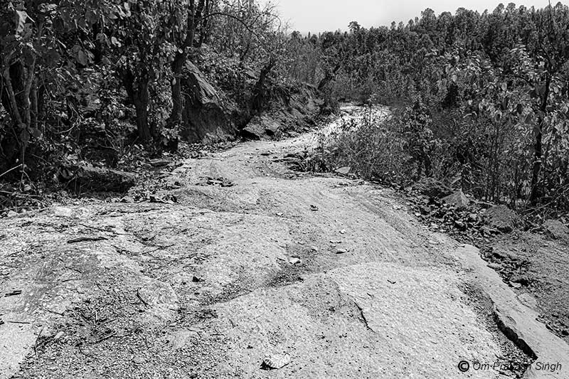 A narrow non-motorable path across a hilly terrain leading to a rural habitation in Gumla district, Jharkhand, India